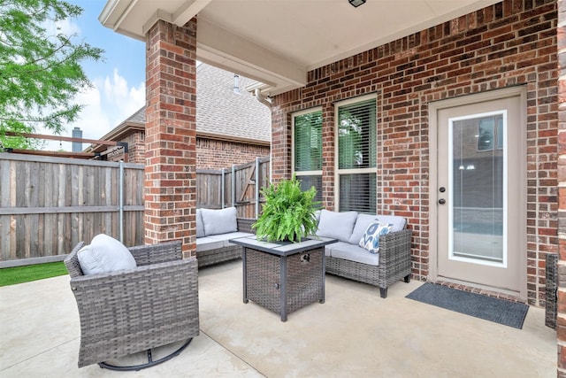 view of patio / terrace featuring fence and an outdoor hangout area