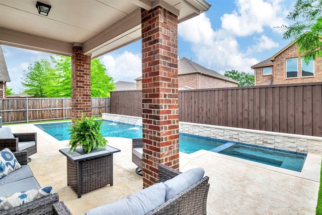 view of swimming pool with outdoor lounge area, a fenced backyard, a fenced in pool, an in ground hot tub, and a patio area
