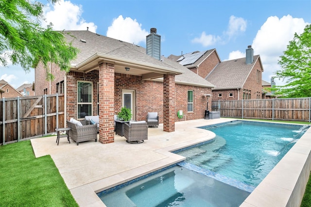 view of swimming pool featuring a fenced backyard, a fenced in pool, a patio, and a jacuzzi