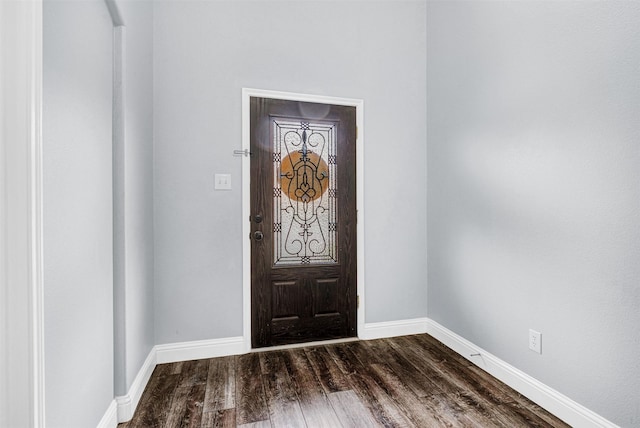 foyer entrance with baseboards and dark wood-style flooring