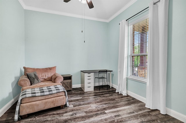 living area featuring baseboards, ornamental molding, wood finished floors, and plenty of natural light
