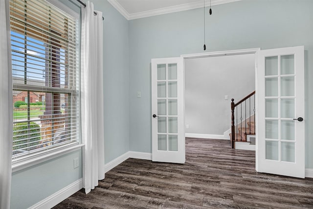 interior space featuring crown molding, dark wood-style flooring, a healthy amount of sunlight, and french doors
