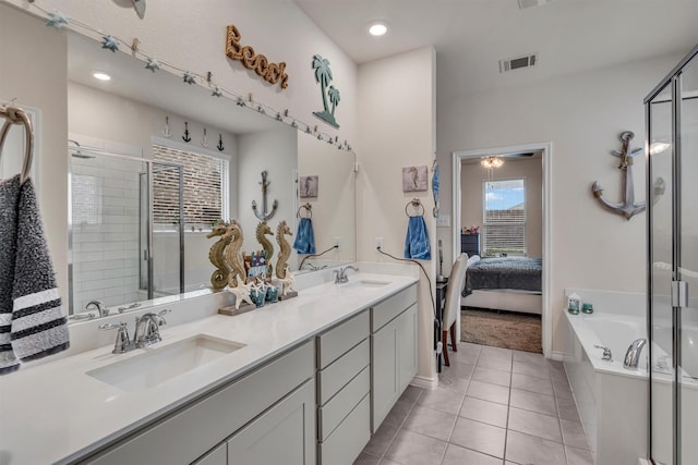 2561 Pettus Dr, Forney, TX 75126 - ensuite bathroom featuring visible vents, a sink, tile patterned flooring, and a stall shower
