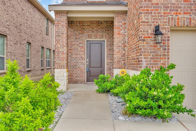2561 Pettus Dr, Forney, TX 75126 - property entrance with brick siding and a garage