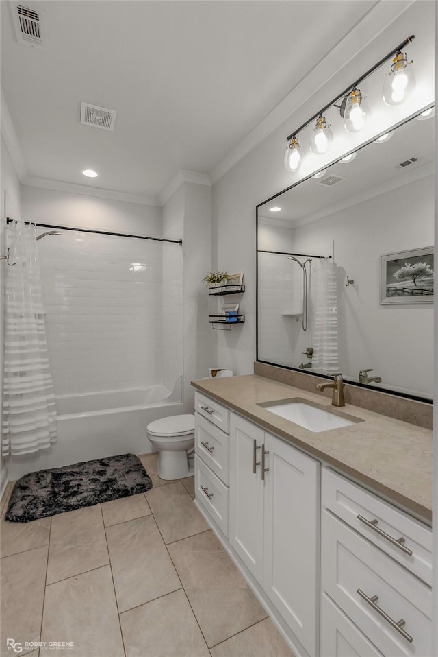 bathroom featuring ornamental molding and visible vents