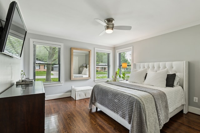 bedroom featuring baseboards, dark wood finished floors, and crown molding
