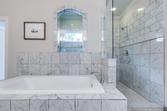 bathroom with crown molding, walk in shower, and a bath