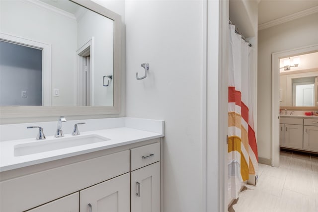 full bath with crown molding, curtained shower, and vanity