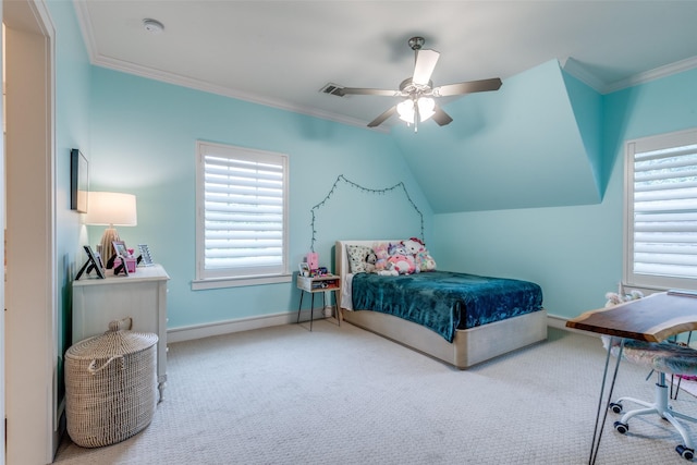 carpeted bedroom featuring crown molding, baseboards, visible vents, and ceiling fan