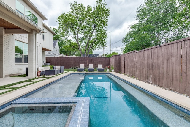 view of swimming pool with a fenced backyard, an outdoor hangout area, a fenced in pool, a patio area, and an in ground hot tub