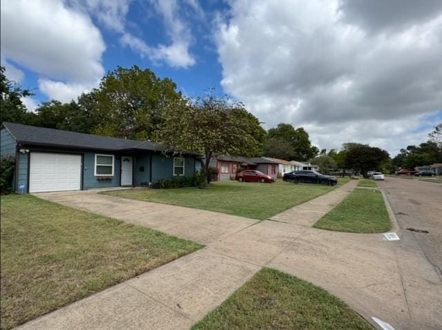 view of front of property with an attached garage, a front yard, and concrete driveway