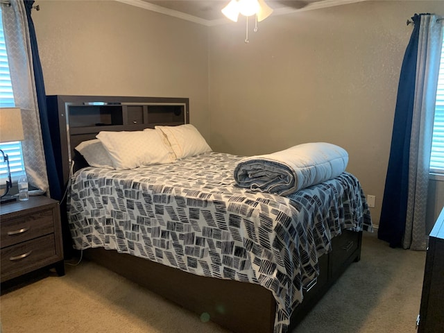 bedroom featuring ornamental molding and light carpet