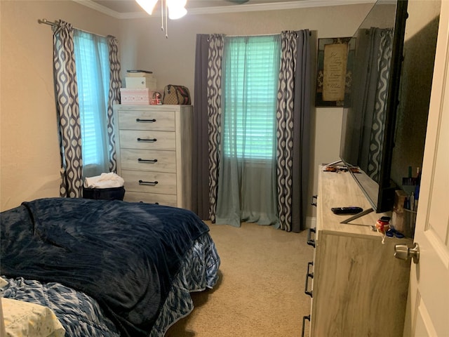 bedroom with crown molding, multiple windows, and carpet