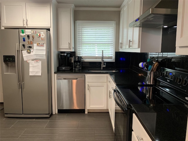 kitchen featuring a sink, appliances with stainless steel finishes, white cabinets, and extractor fan