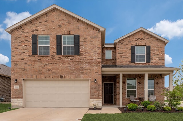 600 Goldenrod Ln, Princeton, TX 75407 - traditional-style home with fence, a front yard, brick siding, concrete driveway, and an attached garage
