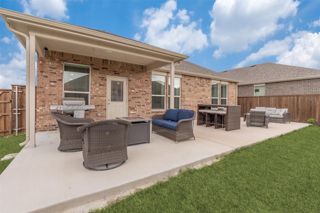600 Goldenrod Ln, Princeton, TX 75407 - rear view of property featuring brick siding, an outdoor hangout area, a fenced backyard, a lawn, and a patio