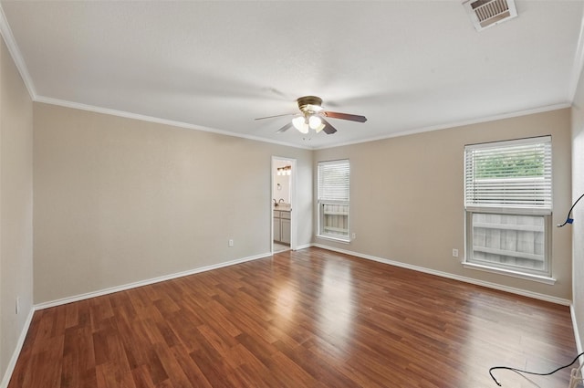 empty room featuring baseboards, a ceiling fan, wood finished floors, and ornamental molding