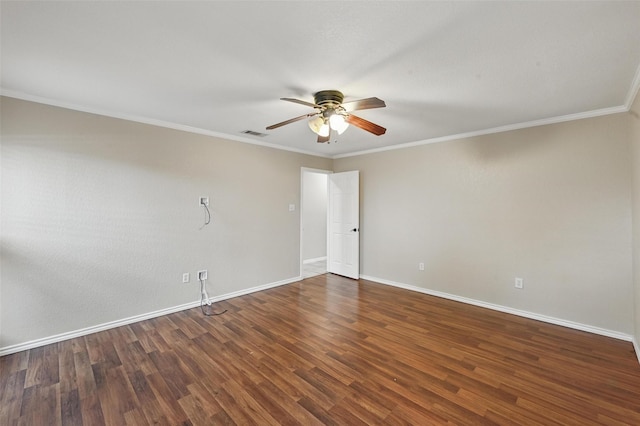empty room featuring crown molding, visible vents, wood finished floors, baseboards, and ceiling fan