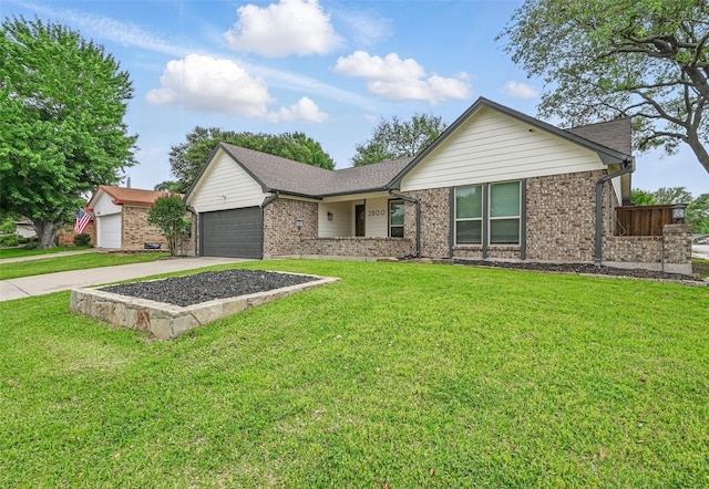 single story home with concrete driveway, brick siding, a front yard, and a garage