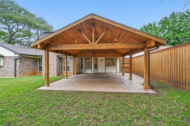 exterior space with fence and a carport