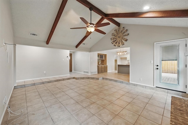 unfurnished living room with ceiling fan, visible vents, beam ceiling, light tile patterned floors, and high vaulted ceiling