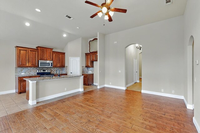 5012 Spruce St, Krum, TX 76249 - bedroom featuring multiple windows, light wood-type flooring, and ceiling fan