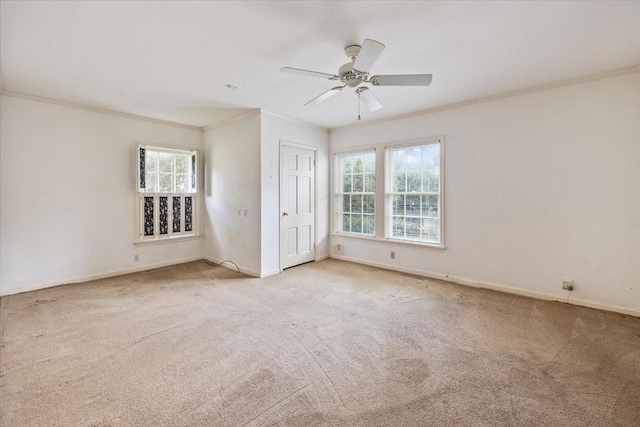 unfurnished bedroom with baseboards, ornamental molding, and carpet