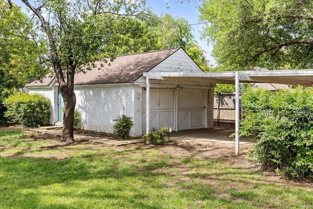 view of outbuilding with an outdoor structure and fence