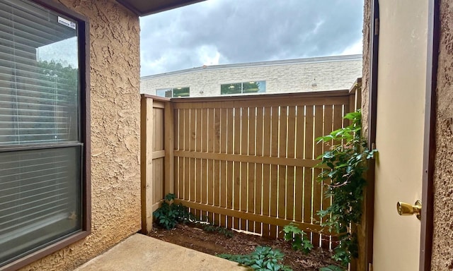 view of gate featuring fence