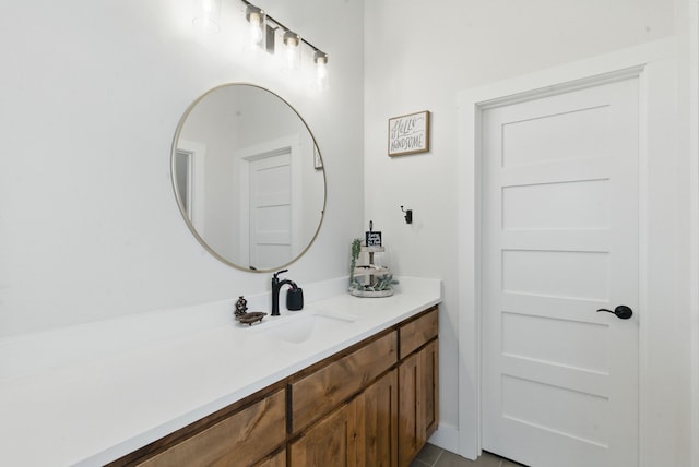 bathroom with tile patterned flooring and vanity