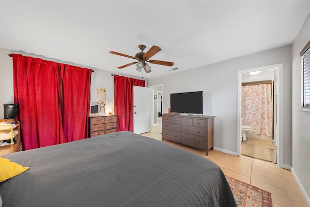 tiled bedroom with visible vents, baseboards, ceiling fan, and ensuite bath