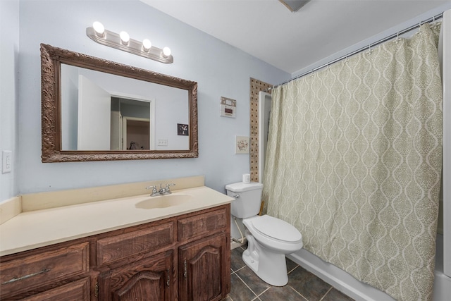 bathroom with tile patterned flooring, curtained shower, toilet, and vanity