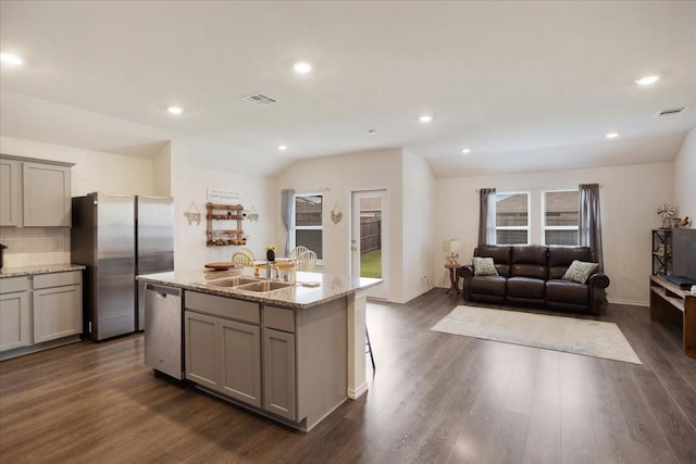 kitchen featuring a sink, appliances with stainless steel finishes, gray cabinets, and visible vents
