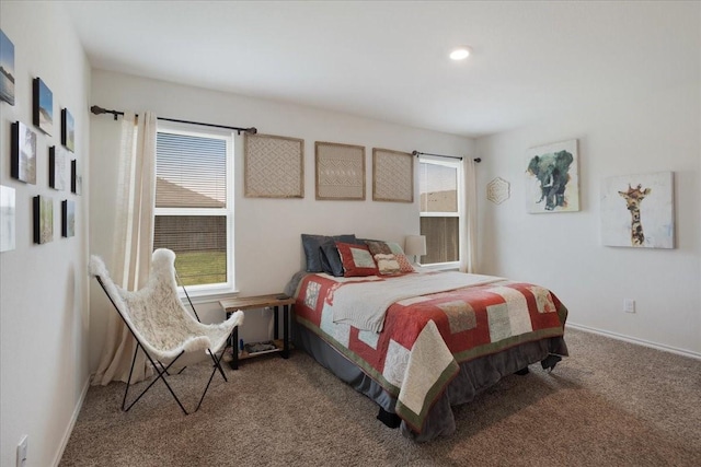 carpeted bedroom with baseboards