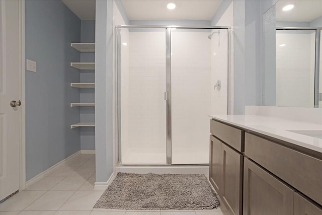 bathroom with vanity, tile patterned flooring, a shower stall, and recessed lighting