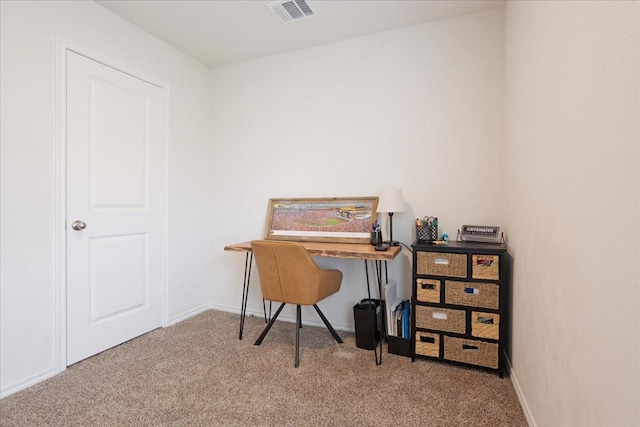 carpeted home office with visible vents and baseboards