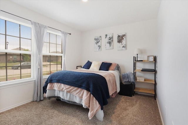 carpeted bedroom with baseboards