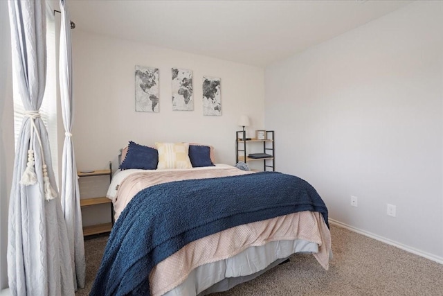 carpeted bedroom with baseboards