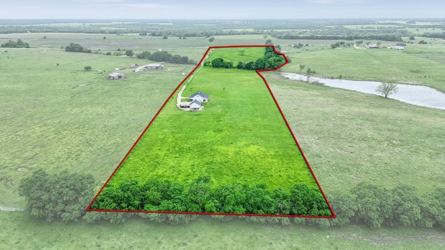 birds eye view of property featuring a rural view