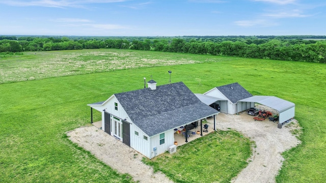 birds eye view of property with a rural view