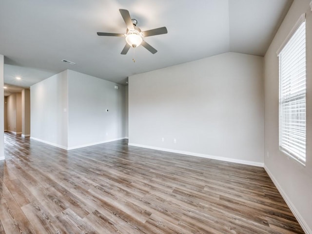 3517 Triumph Dr, Denton, TX 76207 - spare room with plenty of natural light, ceiling fan, wood finished floors, and vaulted ceiling