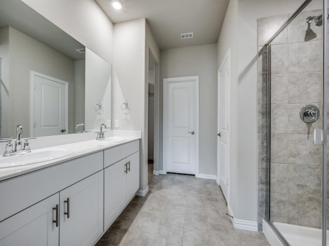 3517 Triumph Dr, Denton, TX 76207 - bathroom featuring a sink, a stall shower, and visible vents
