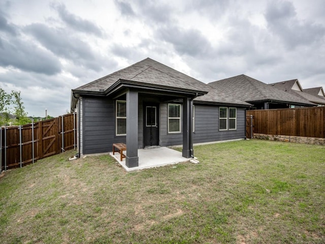 3517 Triumph Dr, Denton, TX 76207 - back of house with a lawn, a patio, a fenced backyard, and roof with shingles
