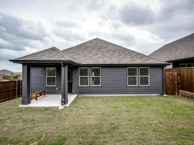 3517 Triumph Dr, Denton, TX 76207 - rear view of house with a lawn, a shingled roof, a fenced backyard, and a patio area