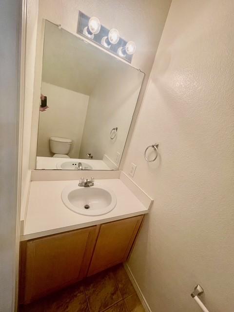 bathroom with vanity and tile patterned floors