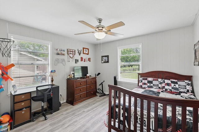 bedroom featuring a ceiling fan and light wood-style flooring