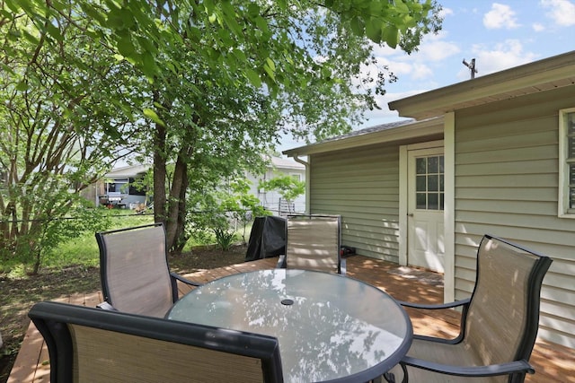 deck with fence and outdoor dining area