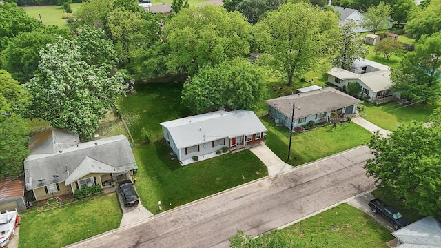 birds eye view of property with a residential view
