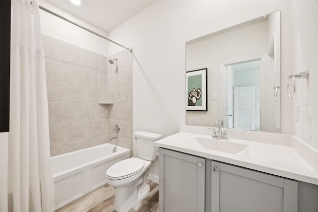 bathroom with vanity, shower / tub combo, wood finished floors, and toilet