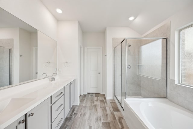 full bath featuring a sink, a wealth of natural light, and a stall shower